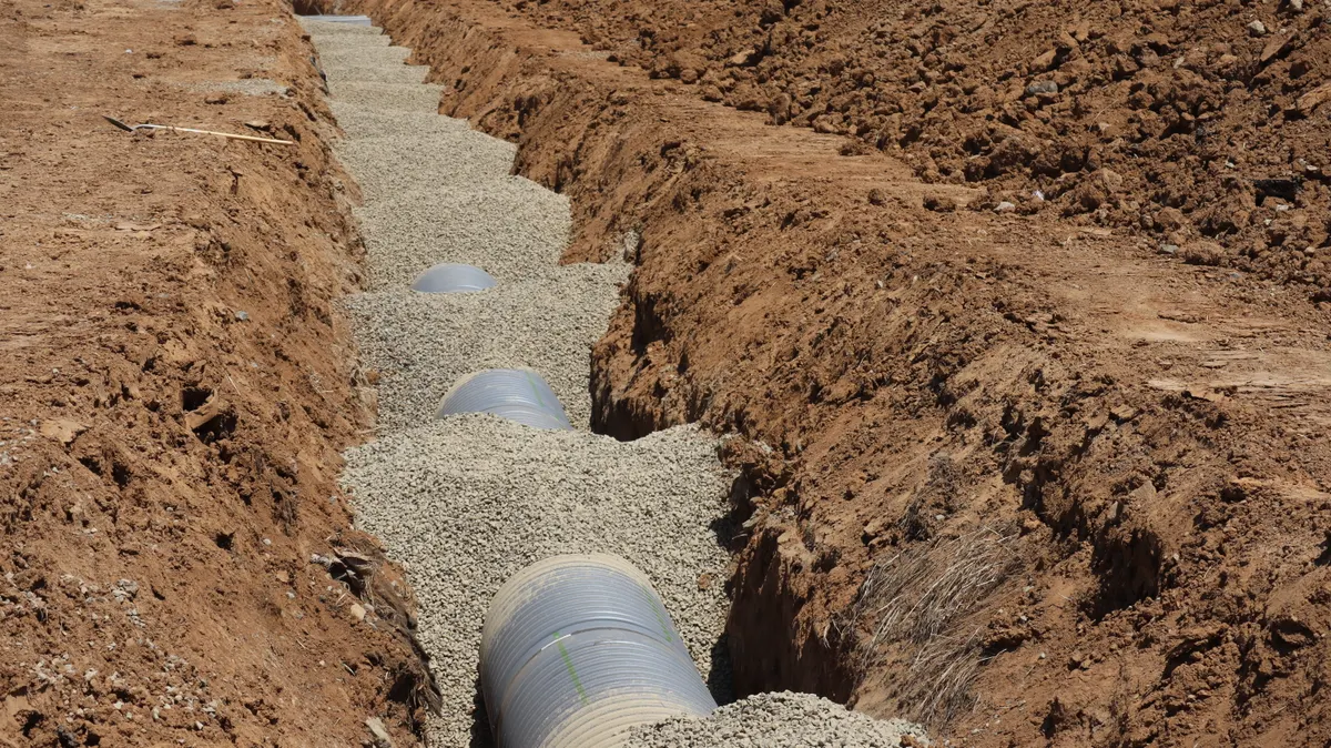 Sewer Line Repair Arizona — drainage pipe construction in a trench