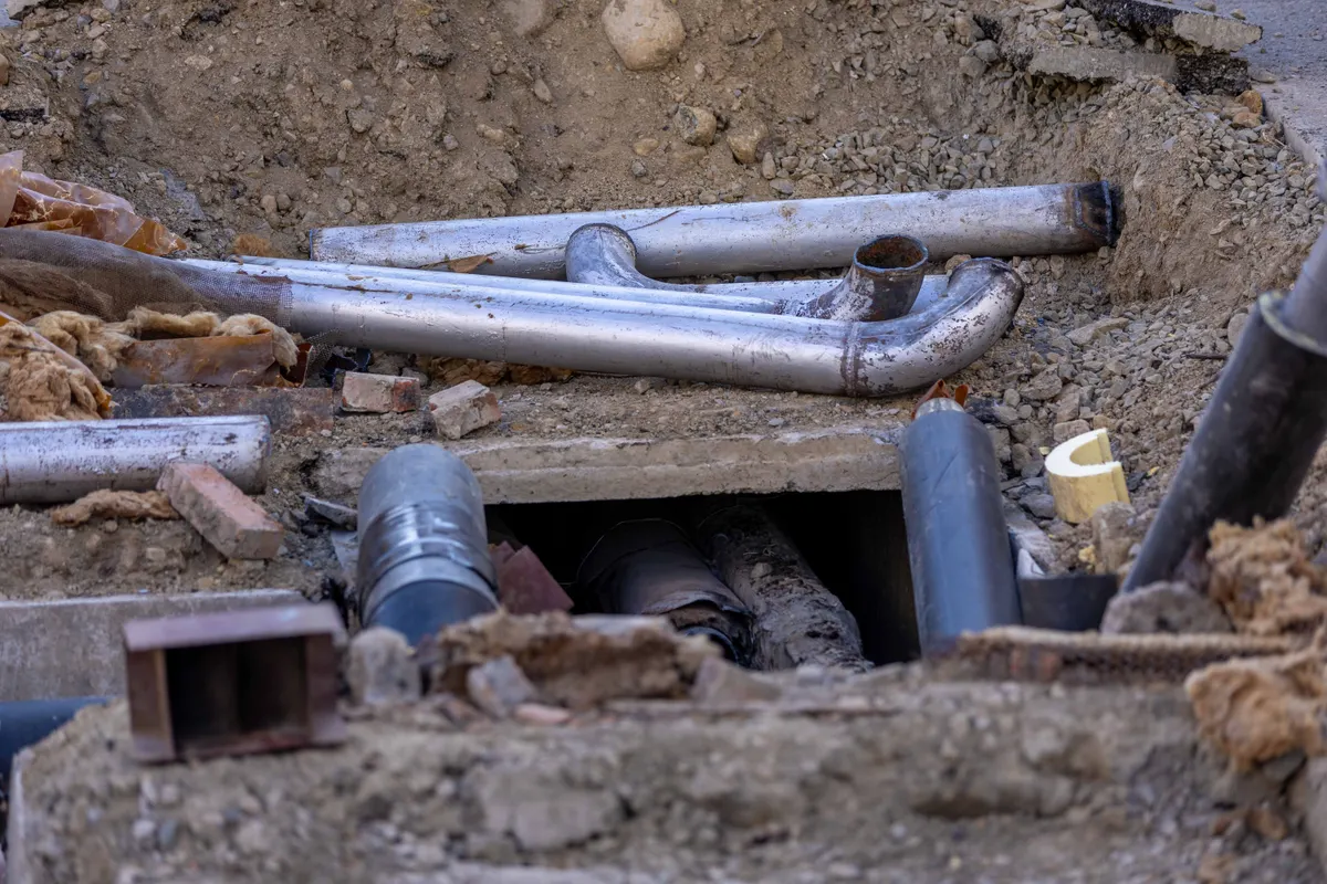 Sewer Line Repair Kirkland WA — underground sewer pipe installation in an open trench